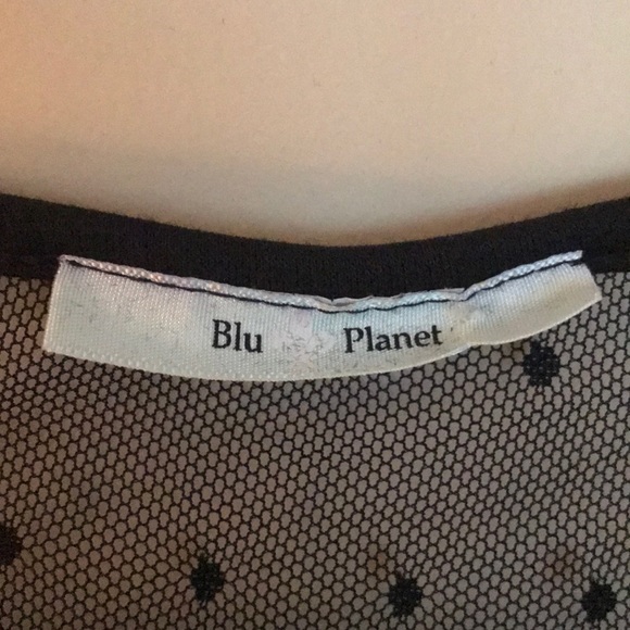 Black Peplum Top with Sheer Polka Dot Back - Picture 3 of 3